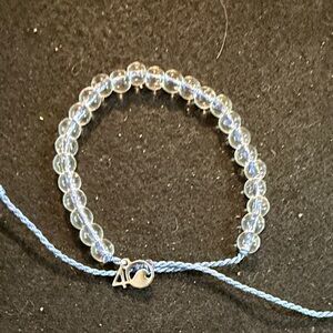 Clear Bead Bracelet with Light Blue Cord and Silver Accent